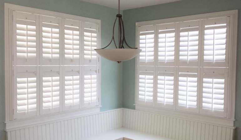 Soft green wall in Jacksonville kitchen with shutters.